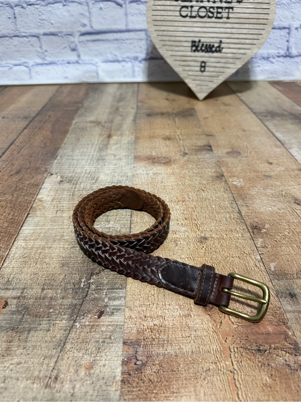 Brown leather braided belt size 31 with brass buckle